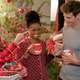 Three people celebrate Christmas morning in a Hallmark movie